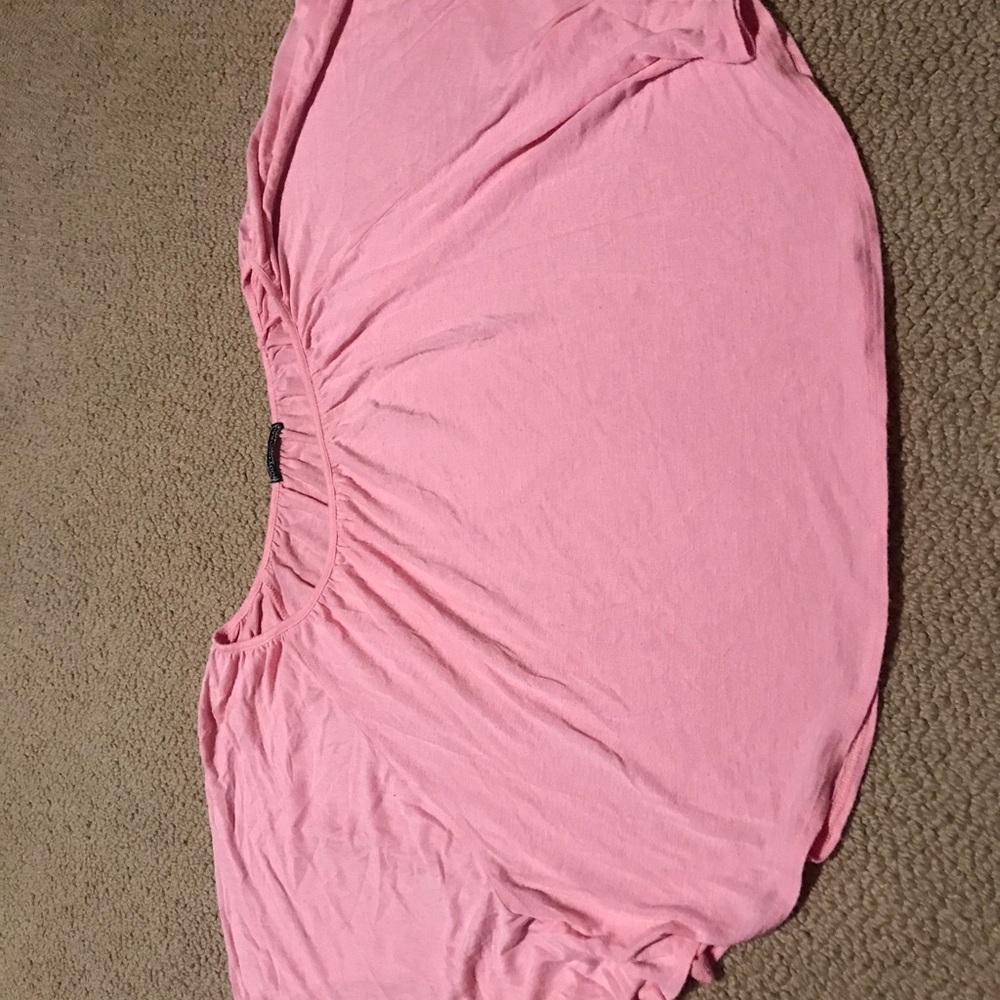 Shirt with sleeves attached to sides